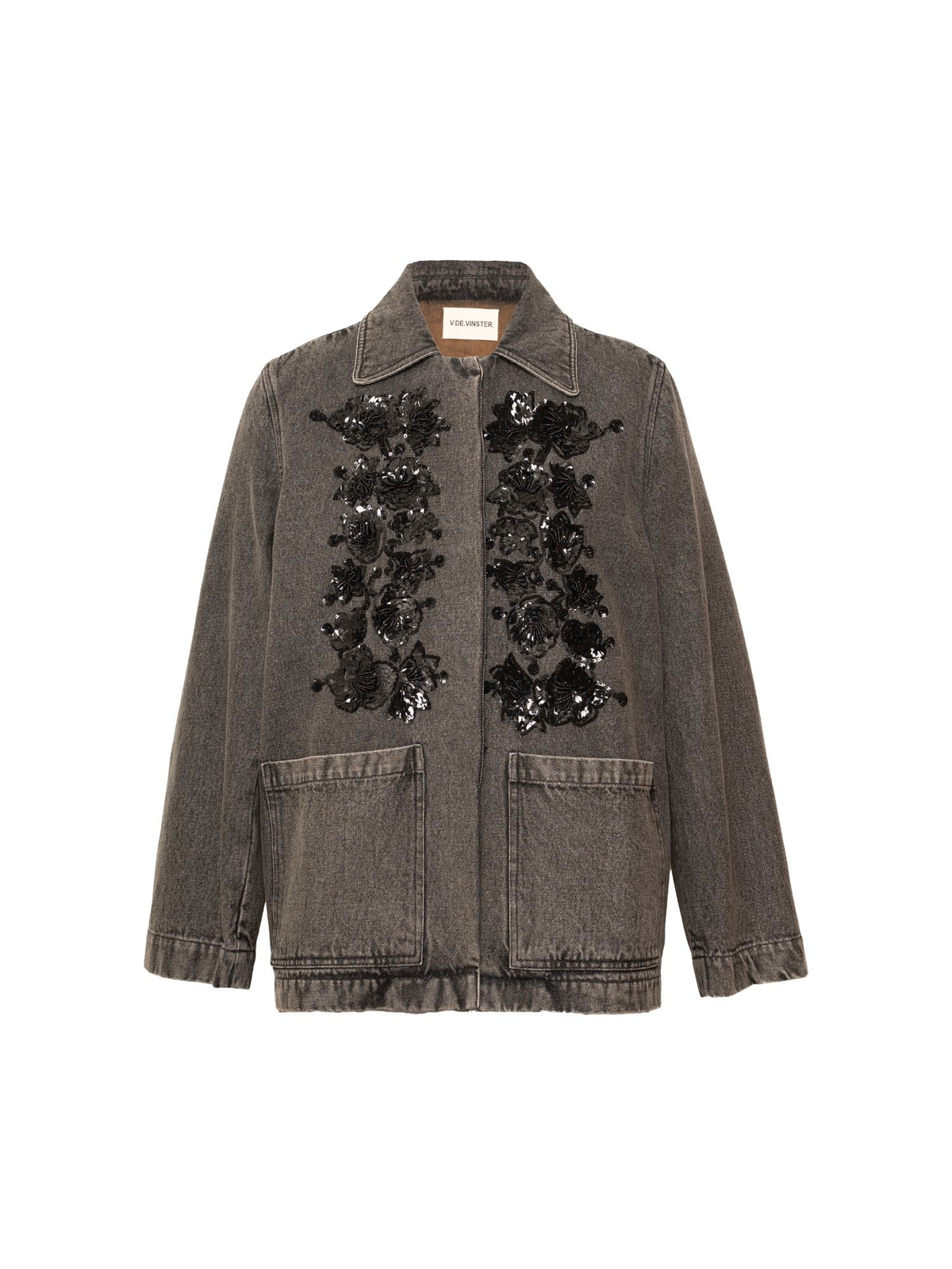 A washed charcoal gray denim jacket featuring black floral sequin embellishments on the front, a pointed collar, and two front patch pockets, shown against a plain white background.