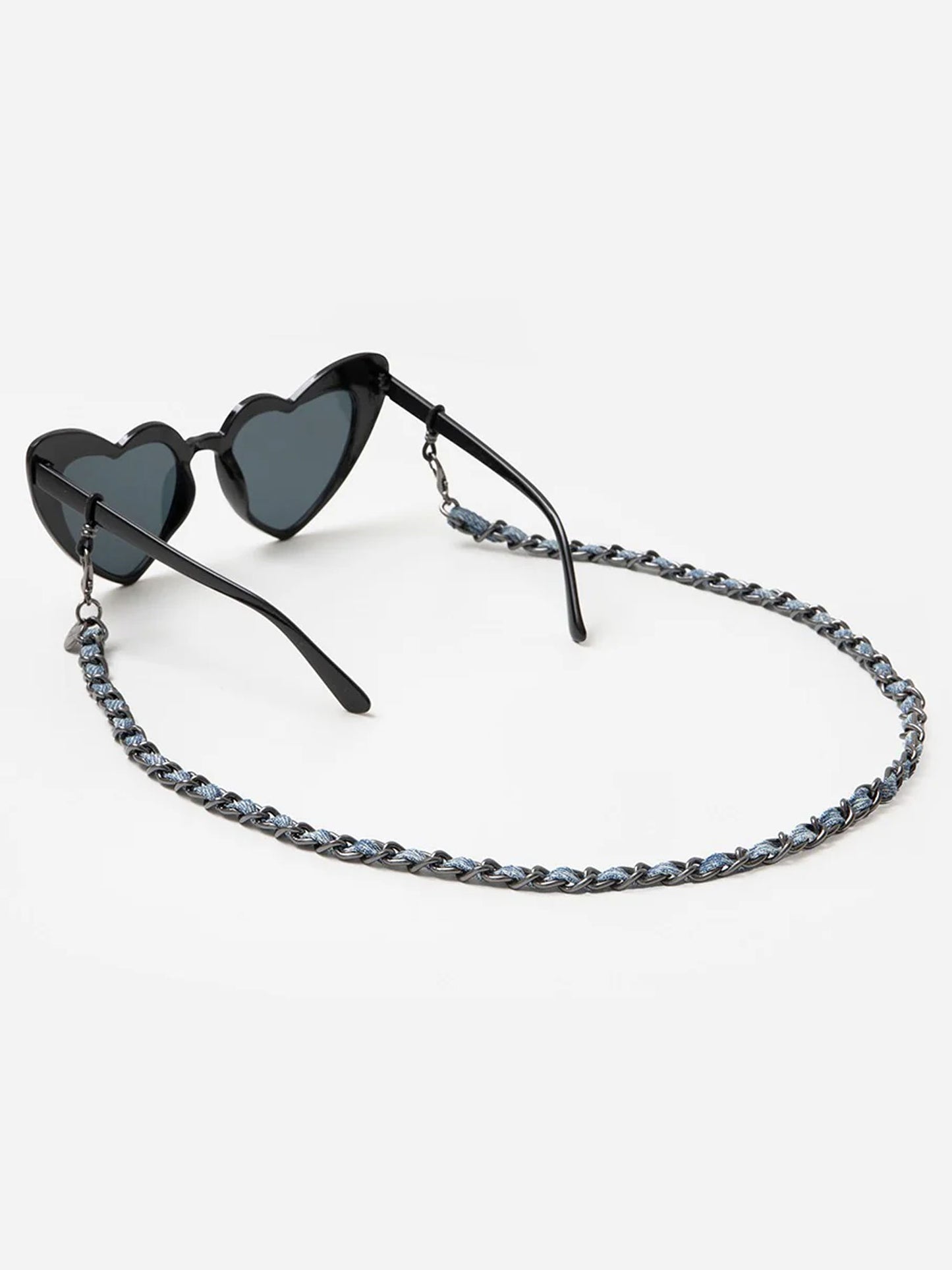 Heart-shaped sunglasses with a chain strap on a white background