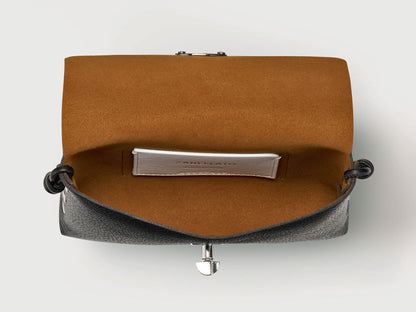 An open black leather clutch bag with a warm brown suede-like interior lining and a silver-tone metal clasp, shown against a light gray background.