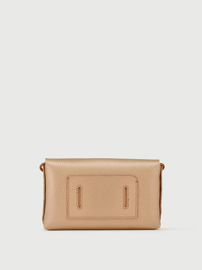 A small pebbled leather clutch bag in a light tan or beige color, featuring a front pocket with two vertical cutouts, shown against a plain light gray background.