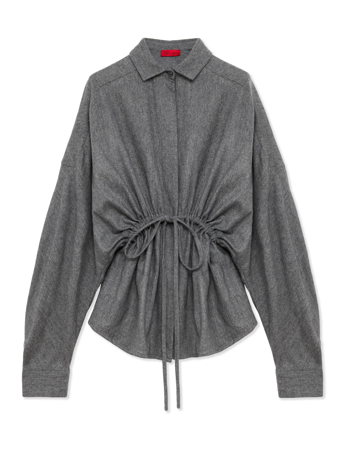 A dark gray long-sleeve shirt with a pointed collar, button-down front, and a drawstring detail at the waist, displayed on a clean white background.
