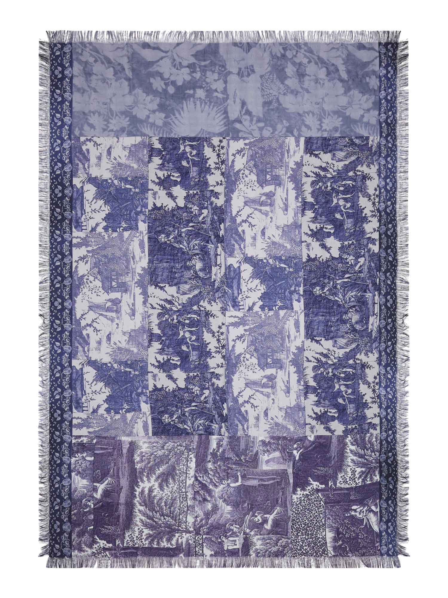 Blue and white patterned throw scarf with fringes on a white background