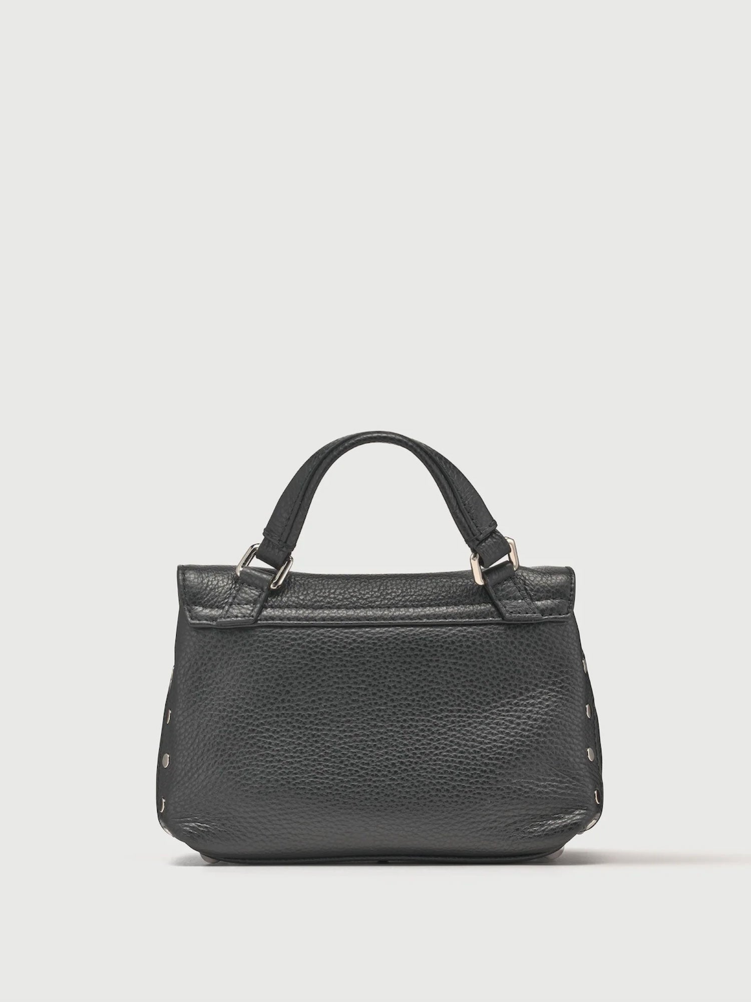 Black leather handbag on a light gray background