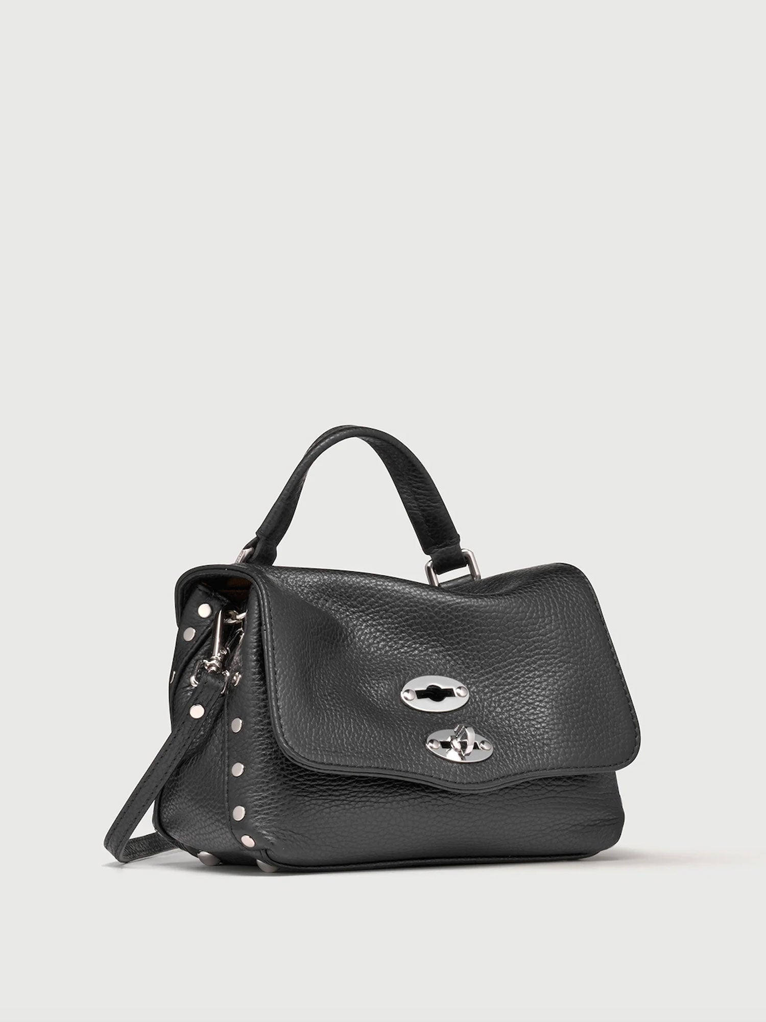 Black handbag with silver accents on a light gray background