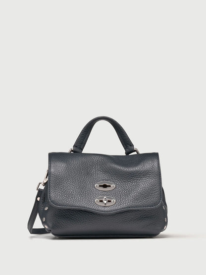 Dark navy handbag with a silver clasp on a light gray background