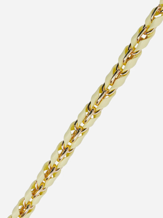 Gold and yellow phone chain on a white background