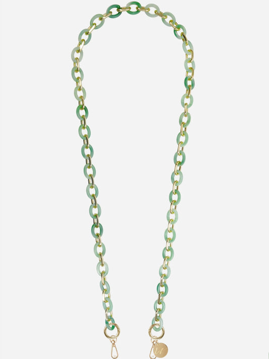 green and gold phone chain on a white background