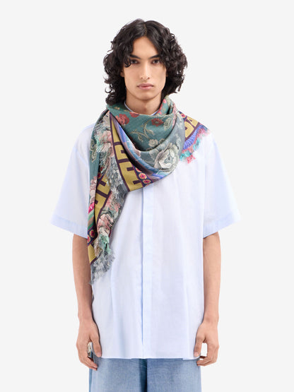 Person wearing a colorful scarf on a white background