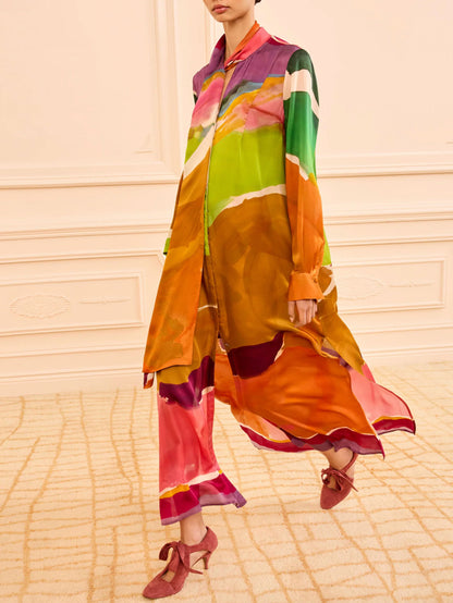 Colourful outfit with a patterned dress on a neutral background