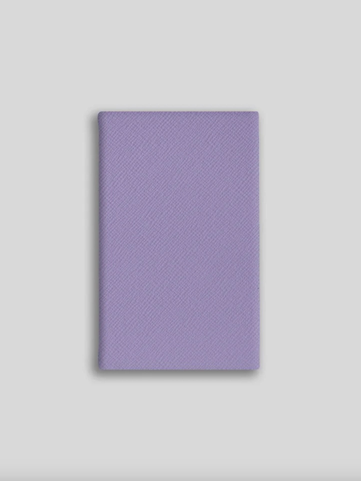 Purple textured notebook on a light gray background