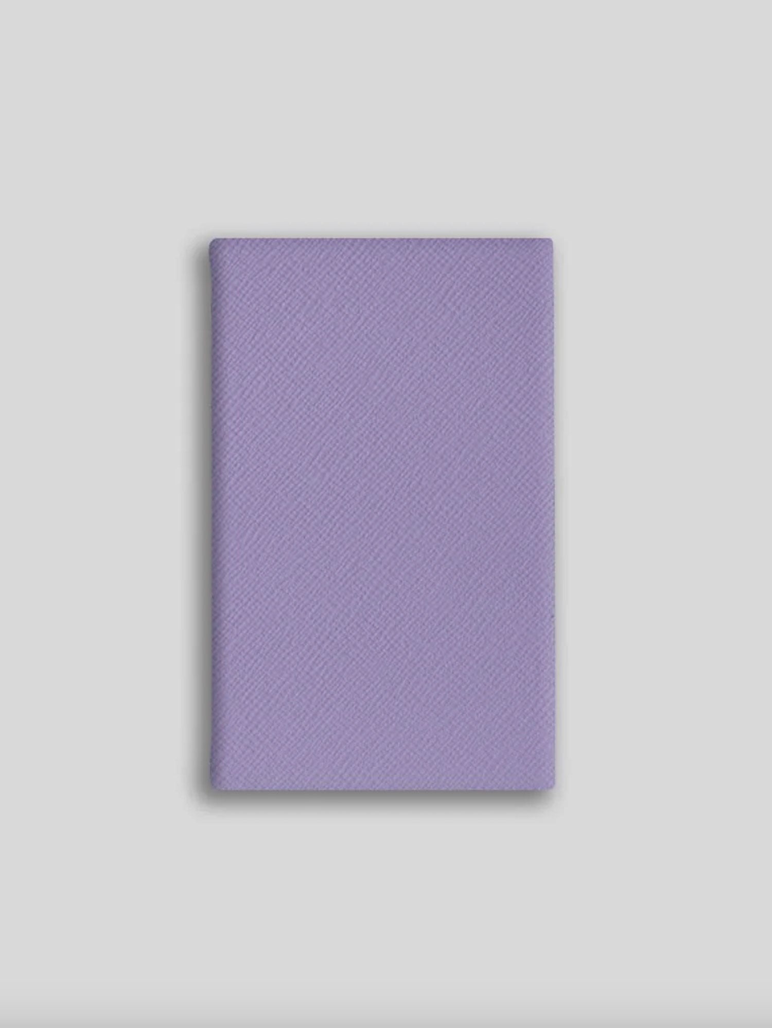 Purple textured notebook on a light gray background