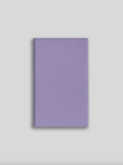 Purple textured notebook on a light gray background