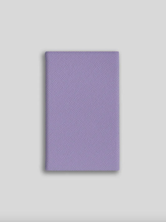 Purple textured notebook on a light gray background