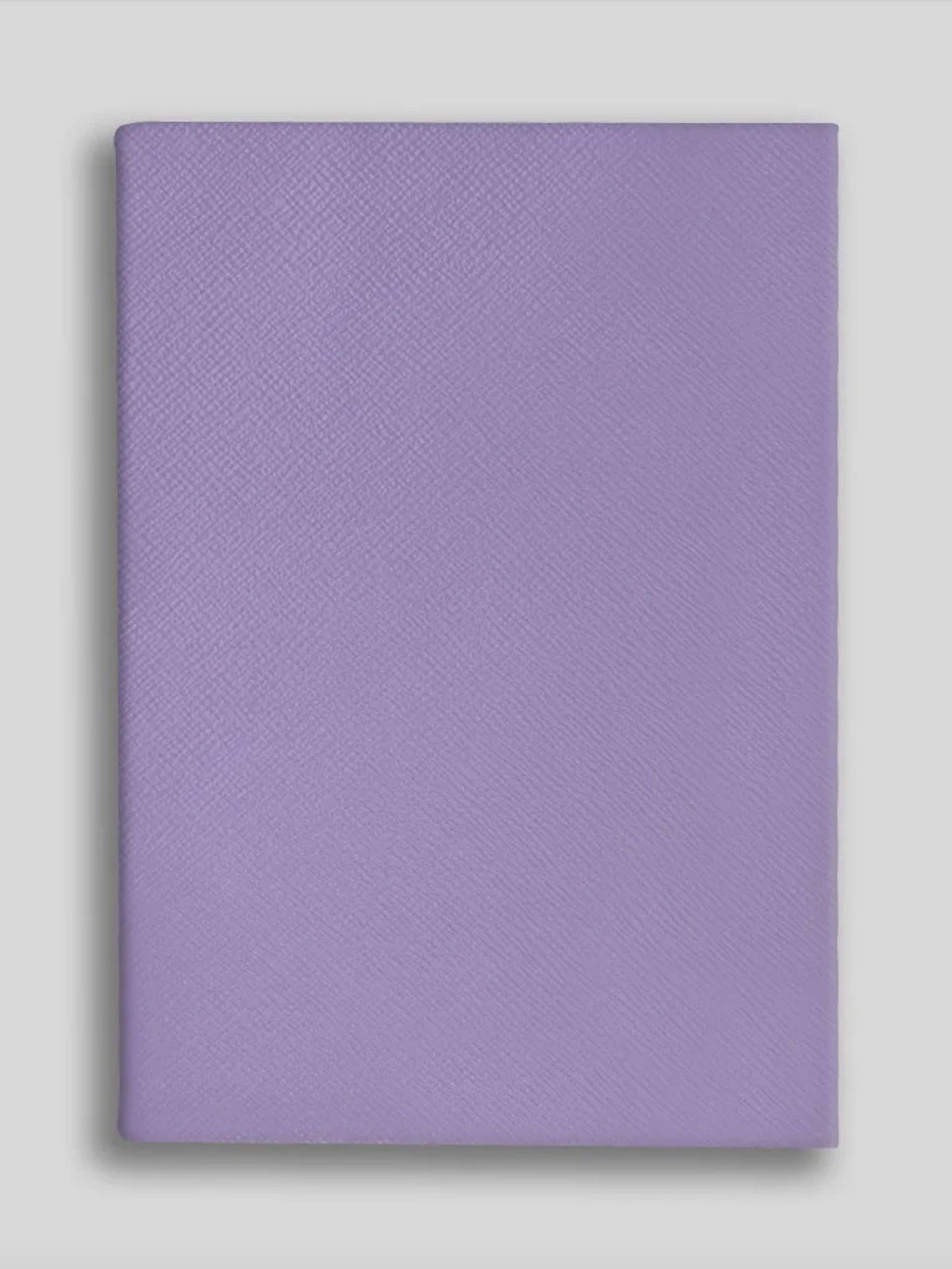 Purple textured notebook on a light gray background