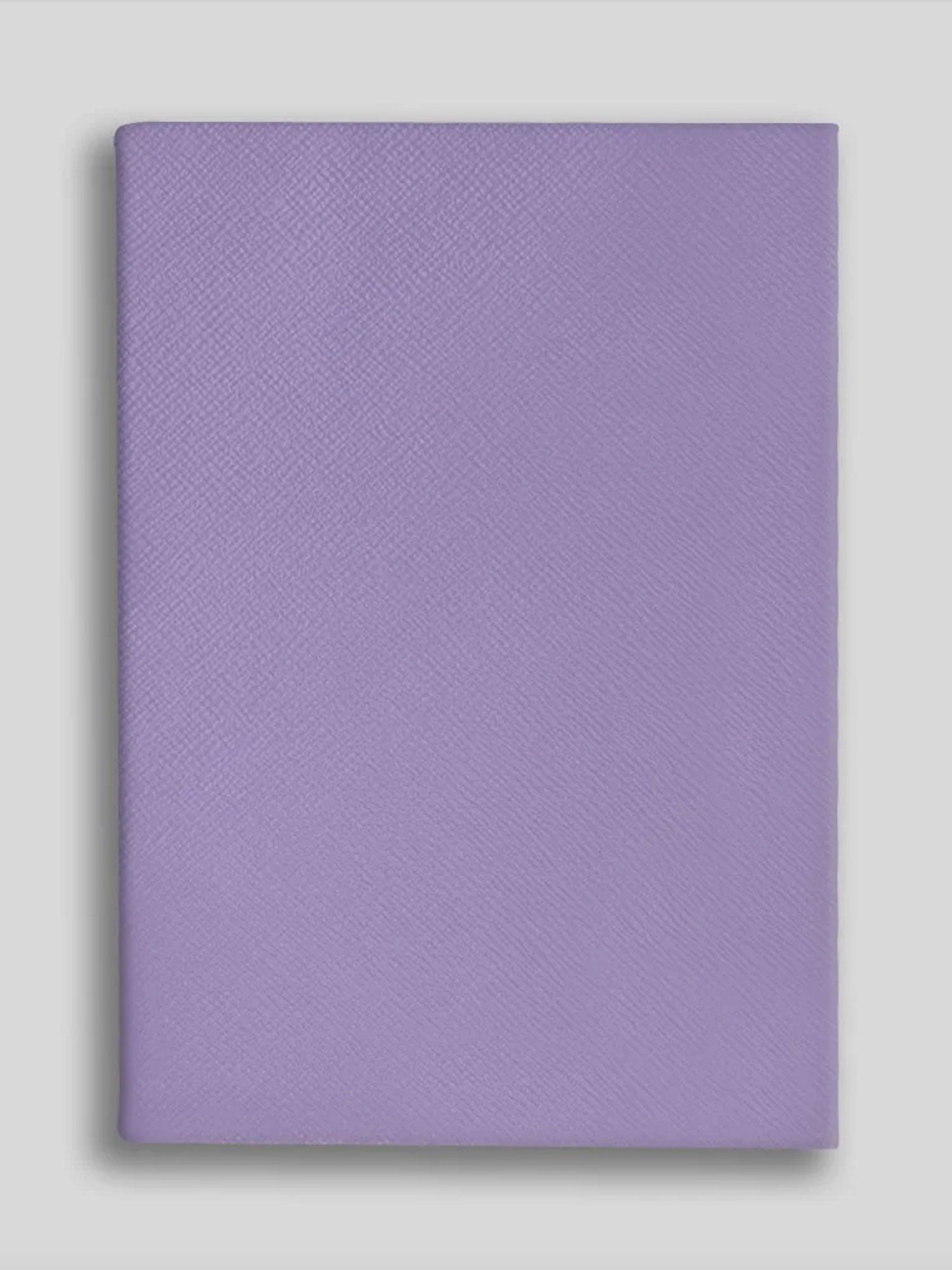 Purple textured notebook on a light gray background