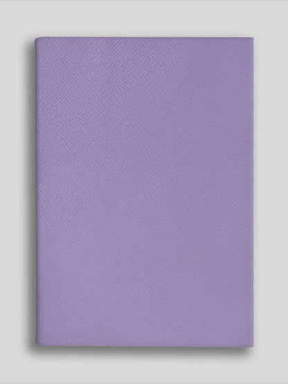 Purple textured notebook on a light gray background