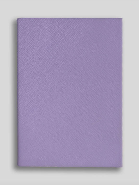 Purple textured notebook on a light gray background