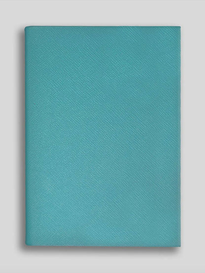Teal notebook on a light gray background