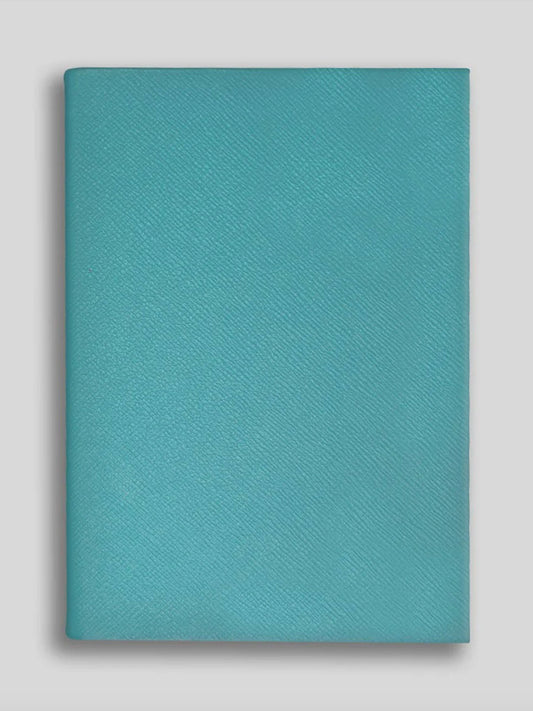 Teal notebook on a light gray background