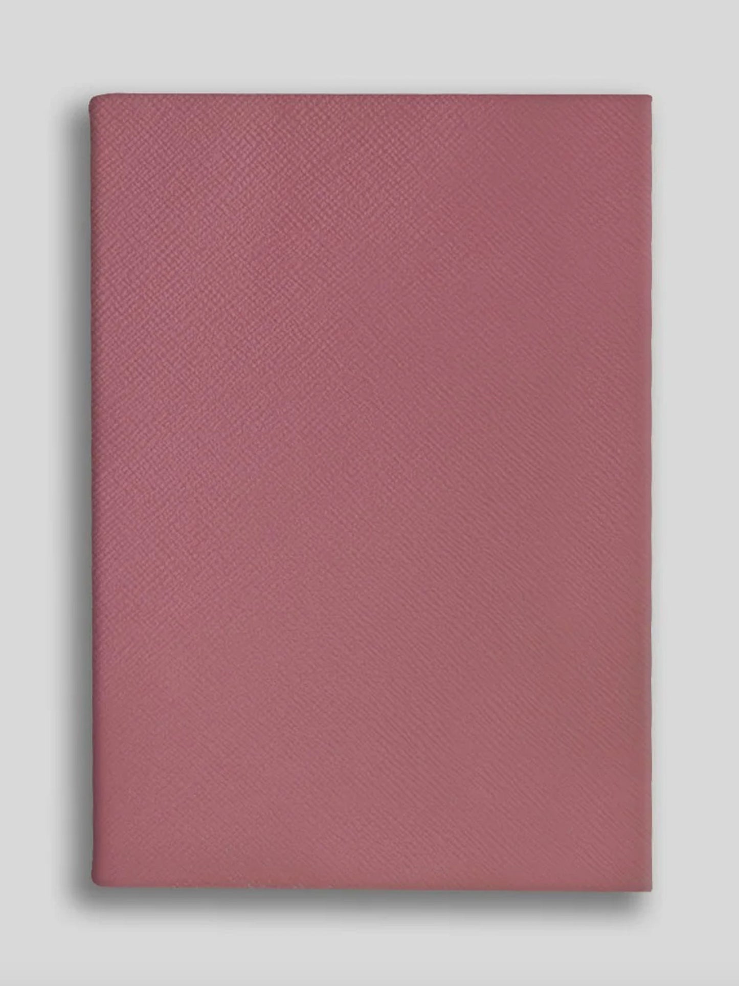 Rose textured notebook on a light gray background