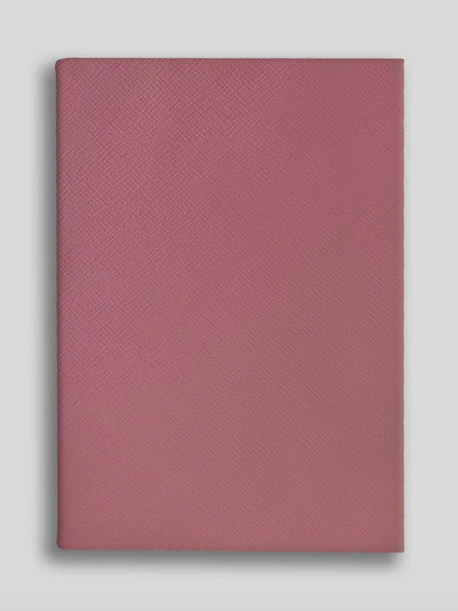 Rose textured notebook on a light gray background