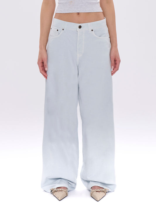 Light blue jeans worn by a person on a white background