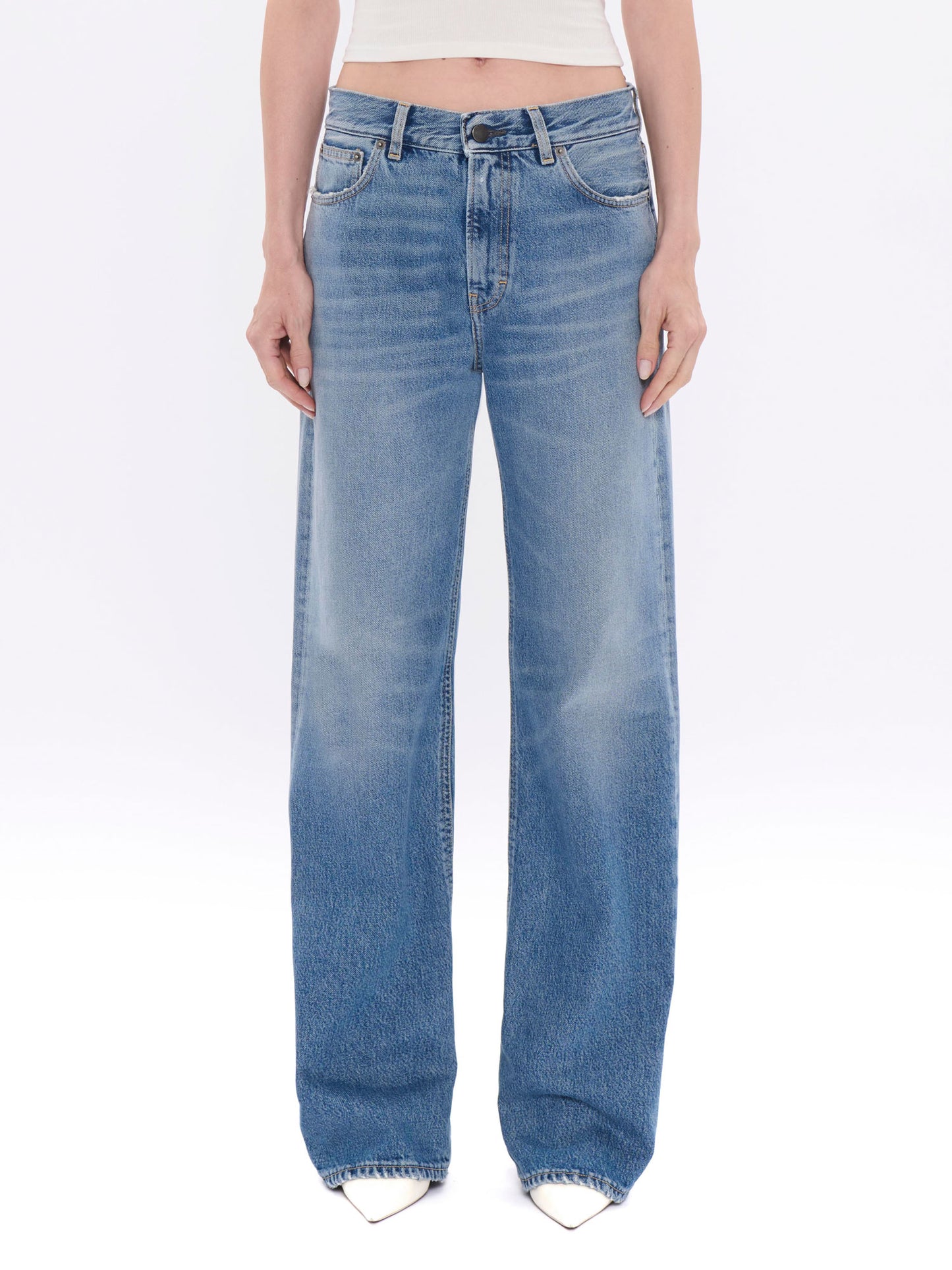 Light blue jeans worn by a person on a white background