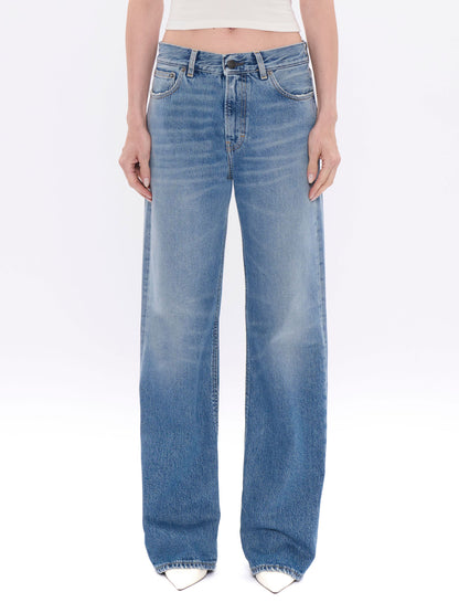 Light blue jeans worn by a person on a white background