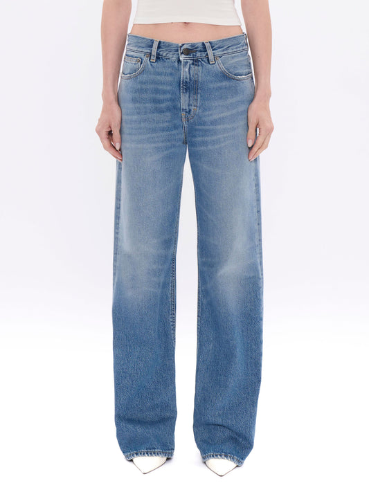 Light blue jeans worn by a person on a white background