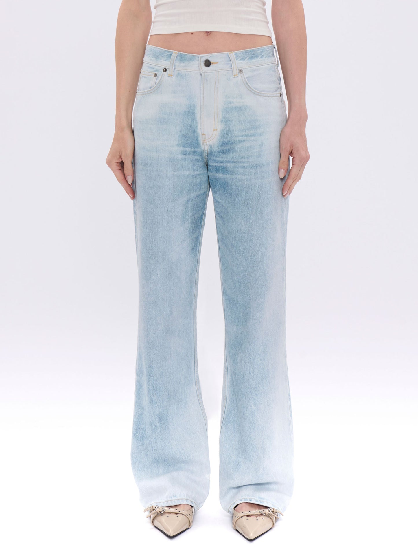 Light blue jeans worn by a person on a white background